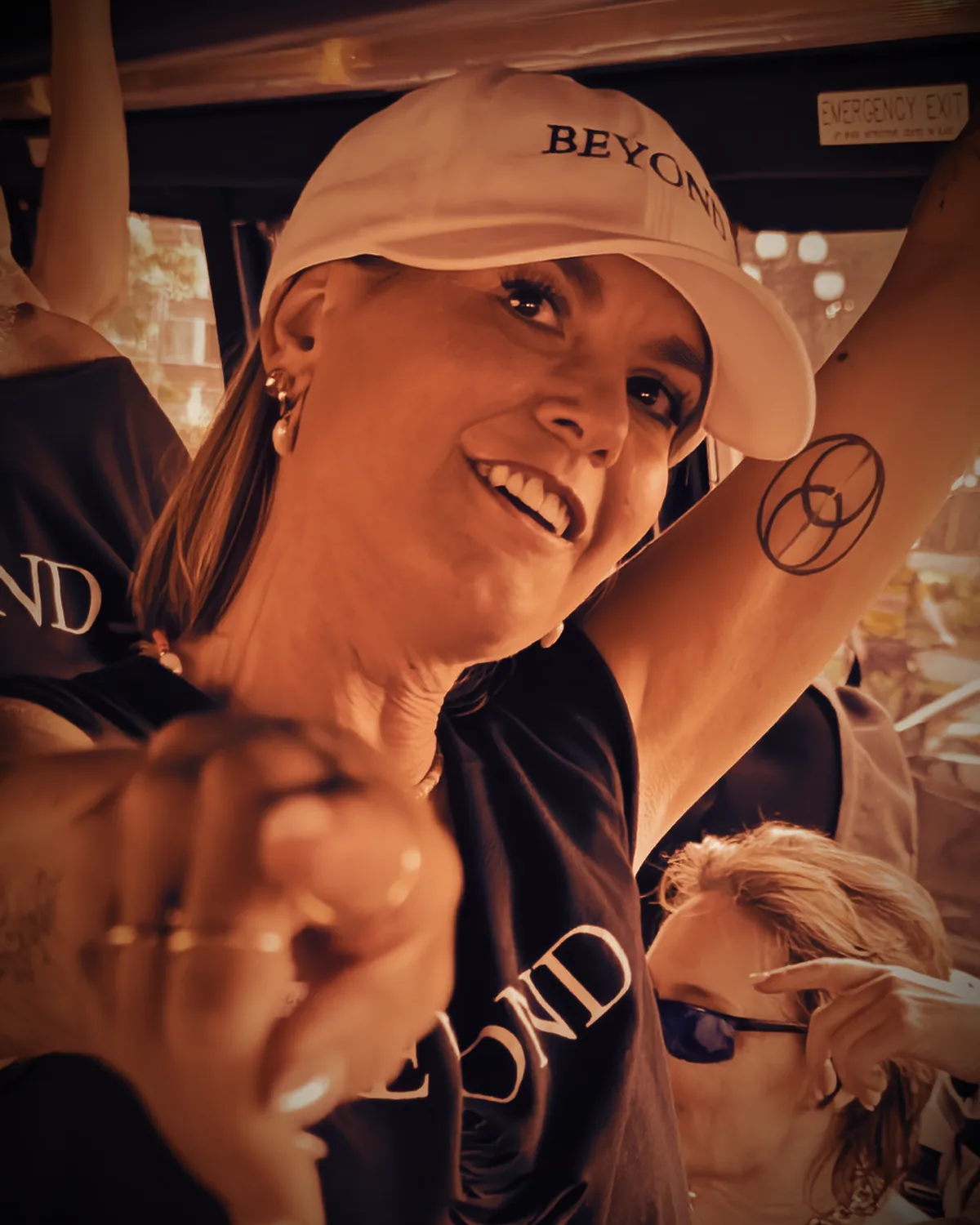 Cortnie Kairos with an arm raised, mid-moment