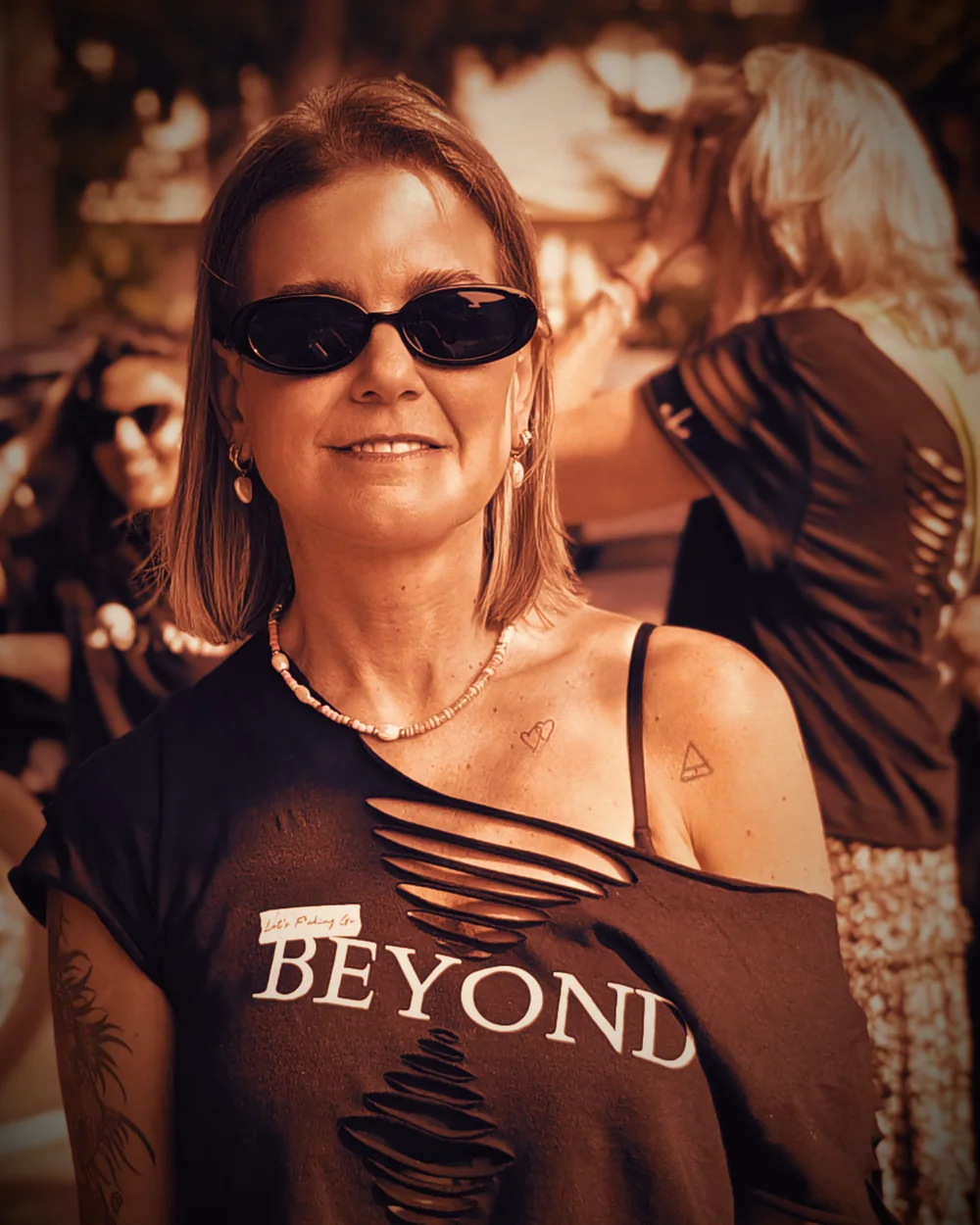 Cortnie Kairos smiling, outdoors in warm light